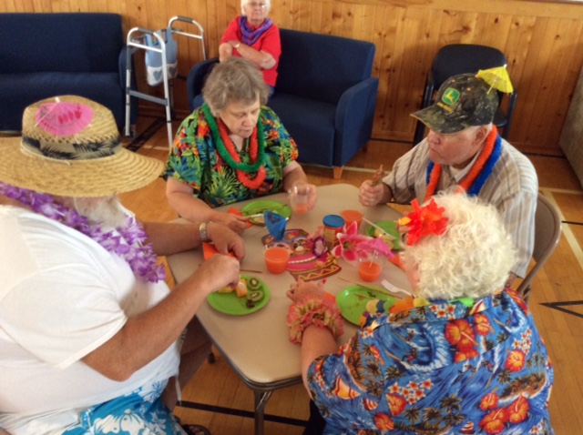 2015 photo luau table of 4 group eating